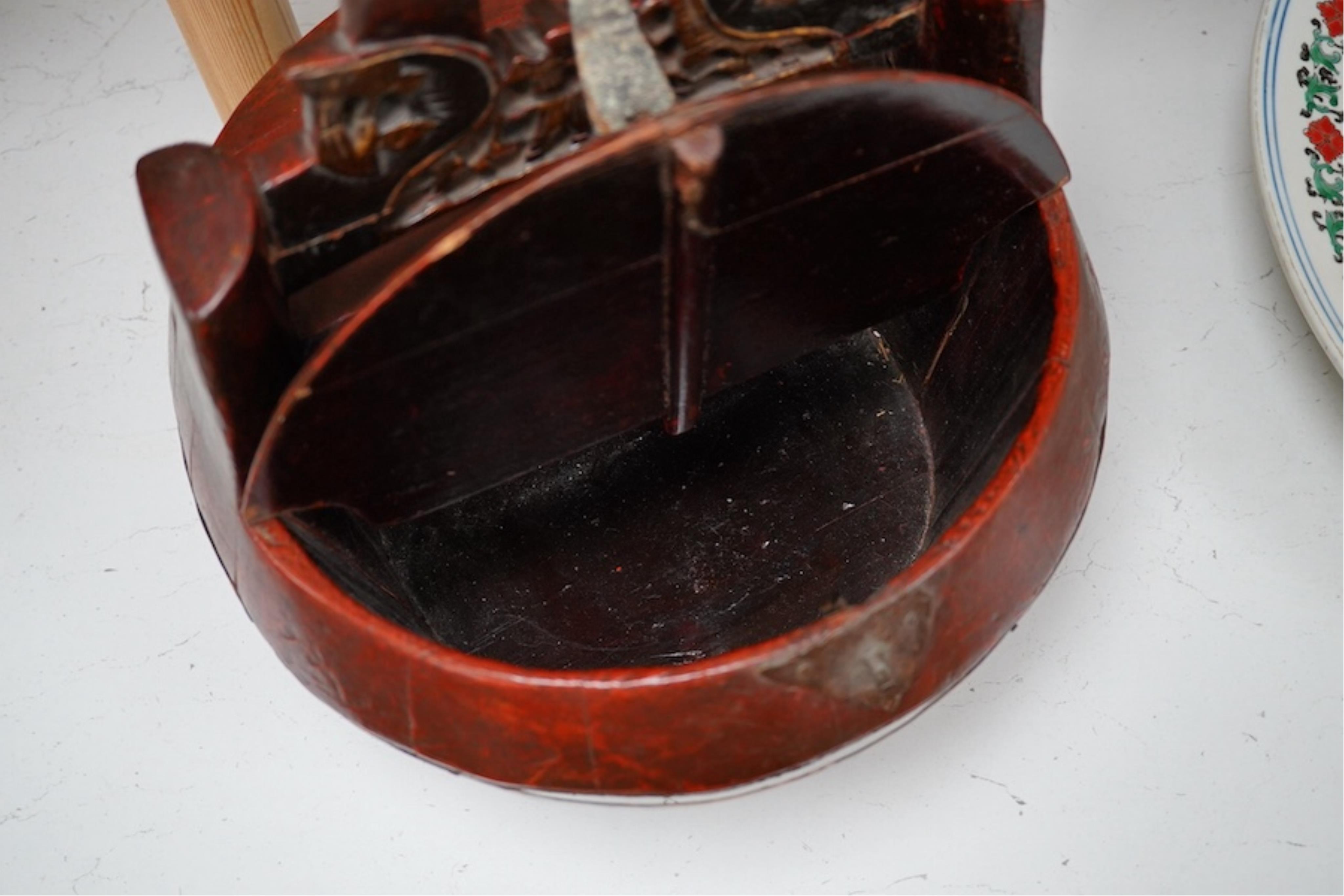 A Chinese red stained and carved food box, 29.5cm high. Condition - fair